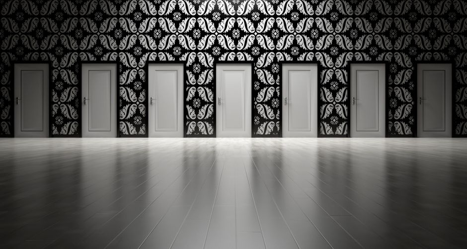 Five closed doors in a black and white ornate hallway symbolizing opportunities and decisions.